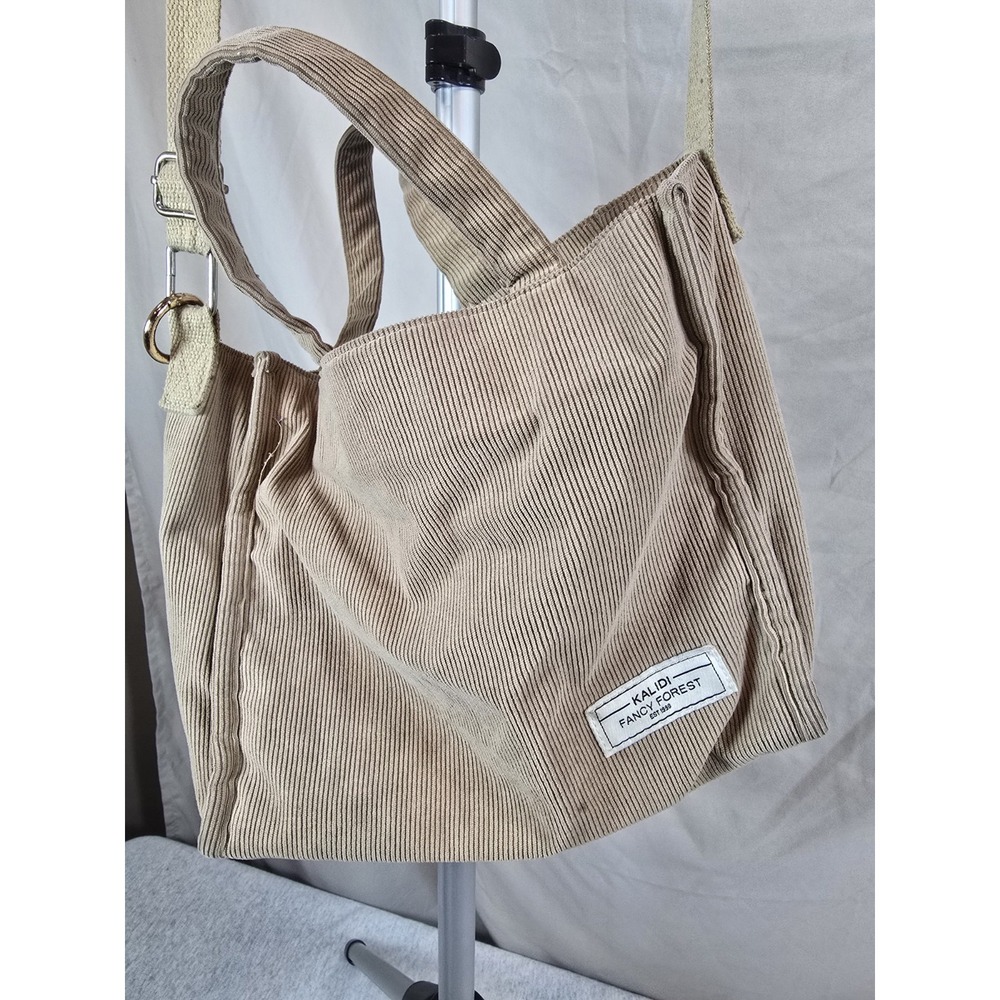 beige KALIDI FANCY FOREST corduroy tote bag featuring both handles and an...